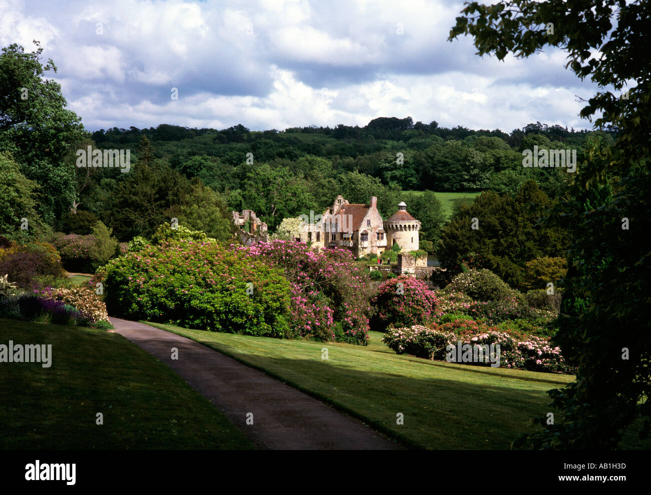 UK England Weald of Kent Scotney Castle set amongst flowering rhododenron Stock Photo