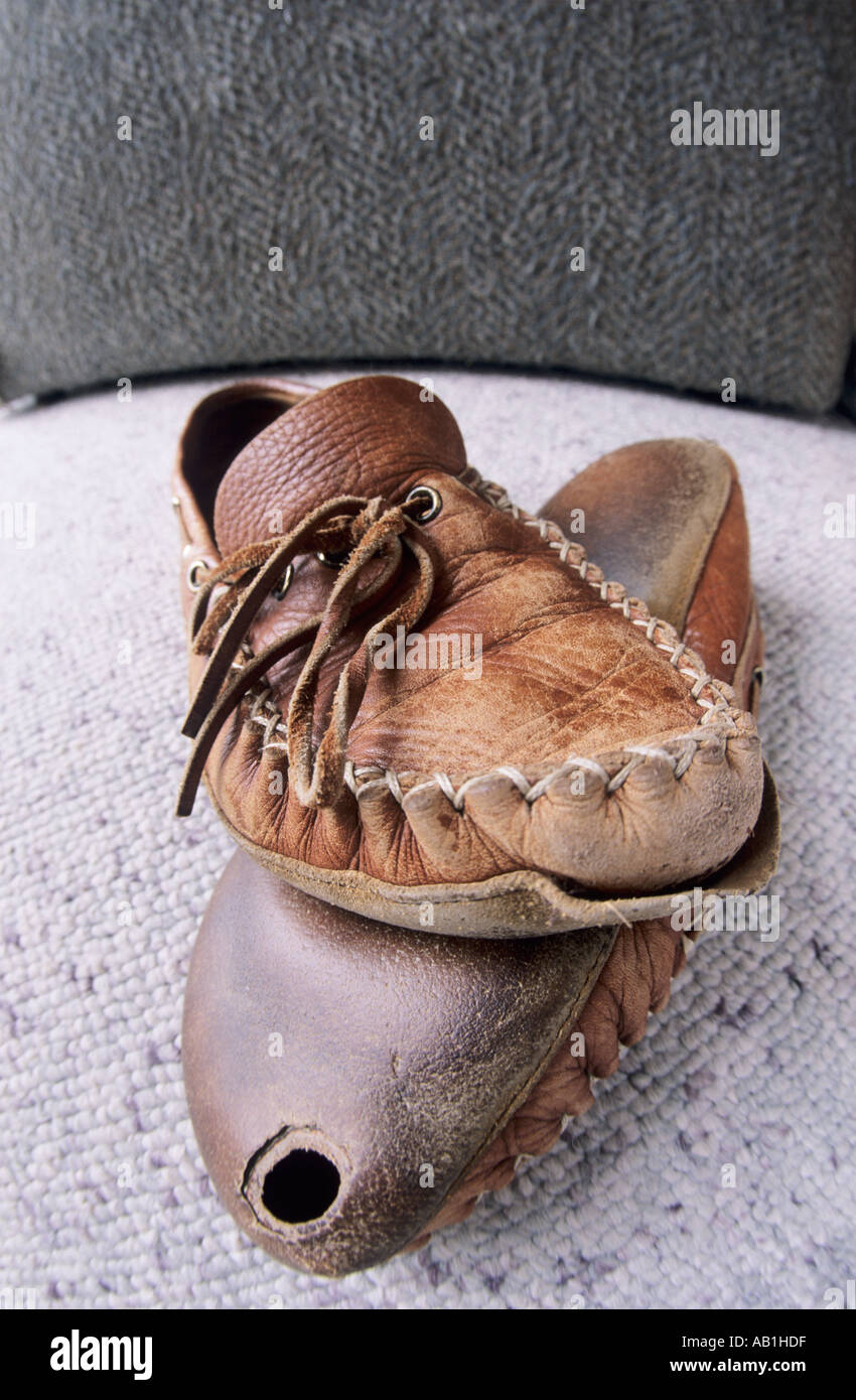 Concept image of old worn out slippers Stock Photo