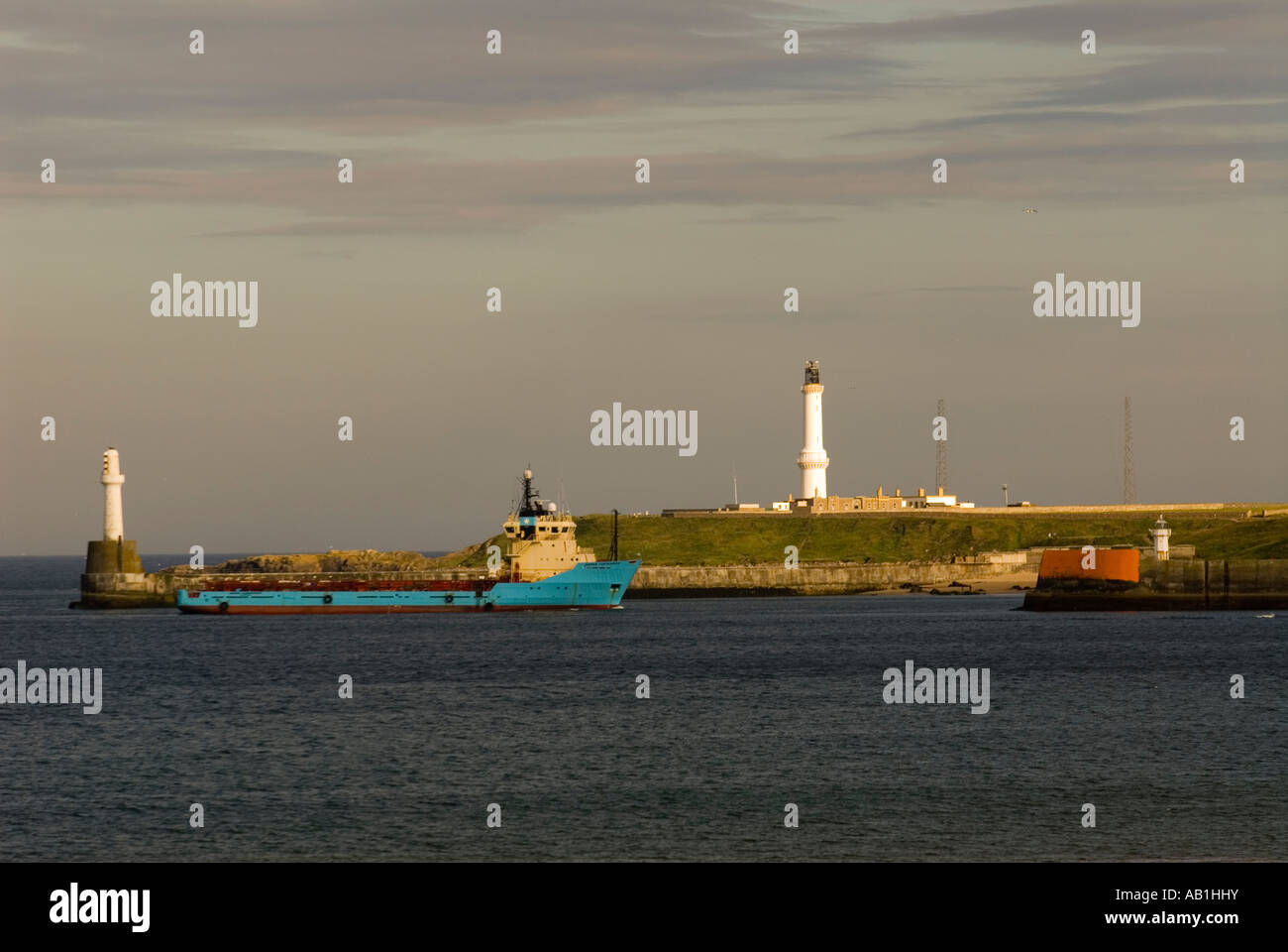 standby vessel entering Aberdeen Harbour Scotland showing lighthouse Stock Photo