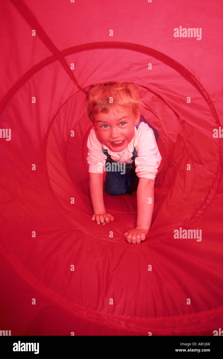 Young boy in play tunnel Smithers, British Columbia Canada Stock Photo
