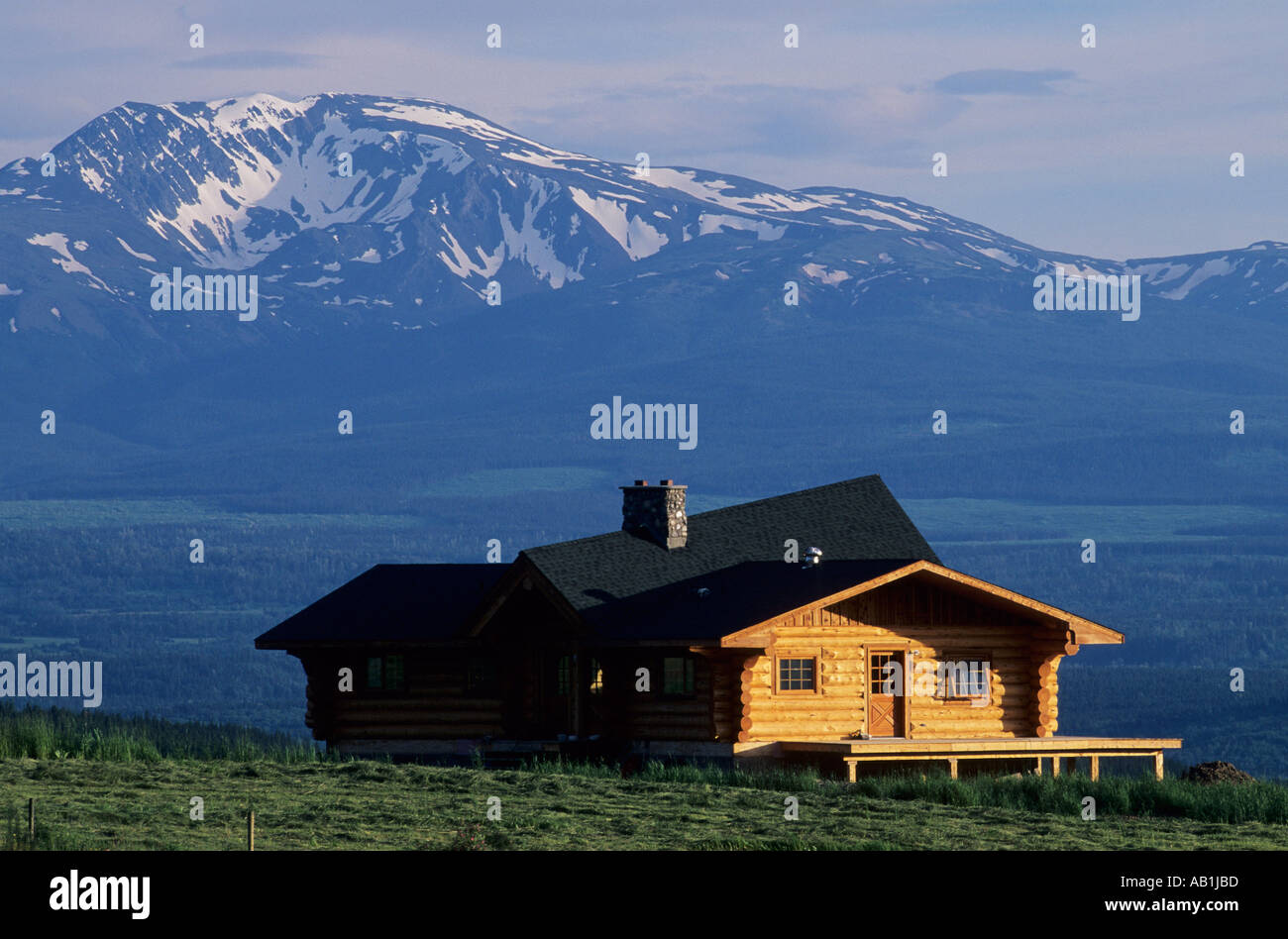 Log house and Telkwa mountains in background Smithers British Columbia