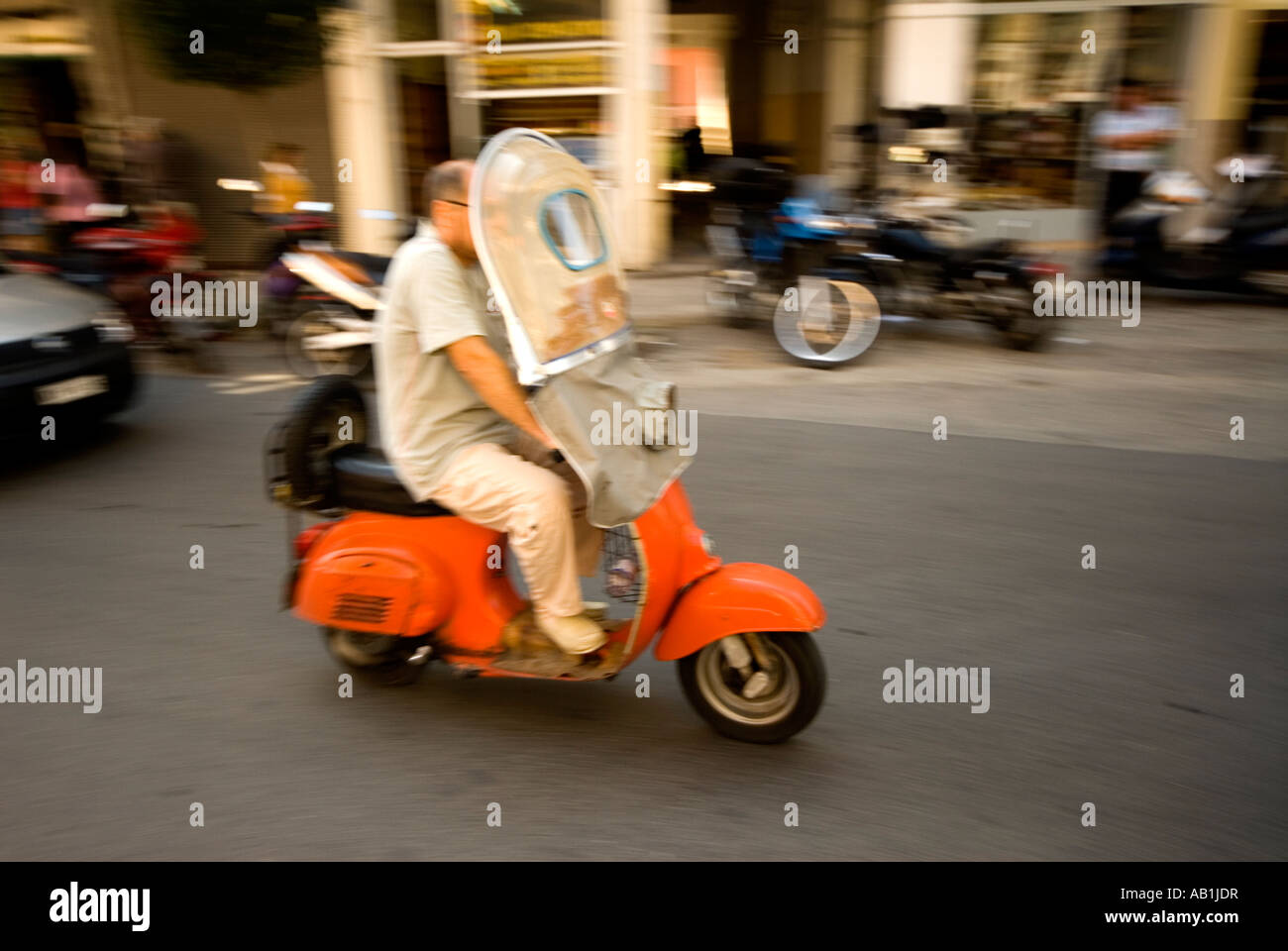 Man commuting on scooter hi-res stock photography and images - Alamy