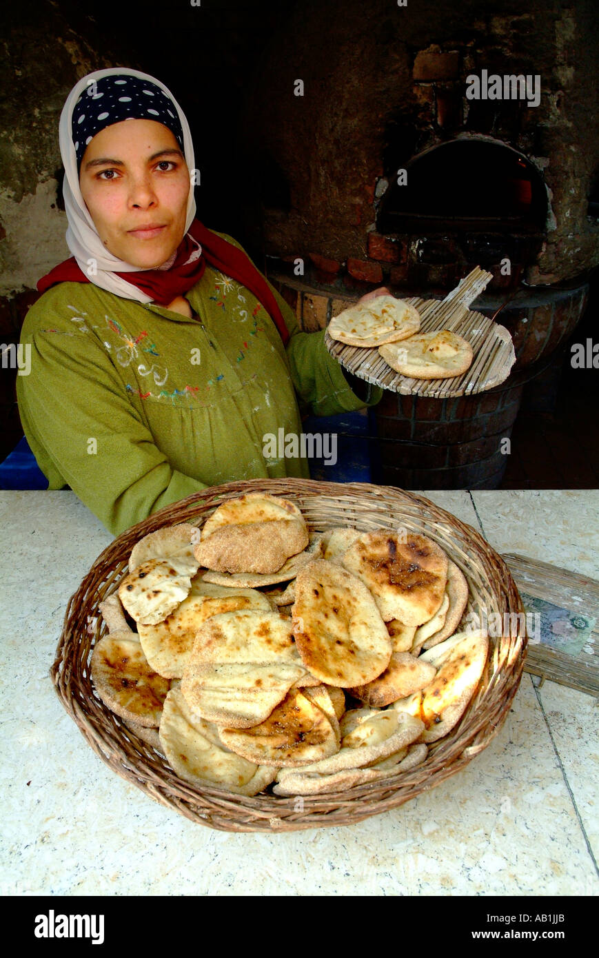 Egyptian woman witk local bread basket,Cairo,Egypt Stock Photo