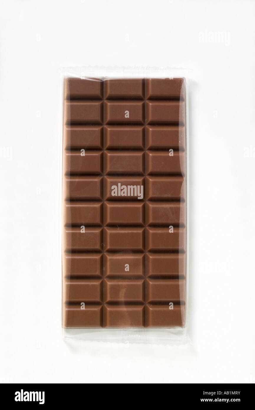 A bar of milk chocolate in cellophane FoodCollection Stock Photo