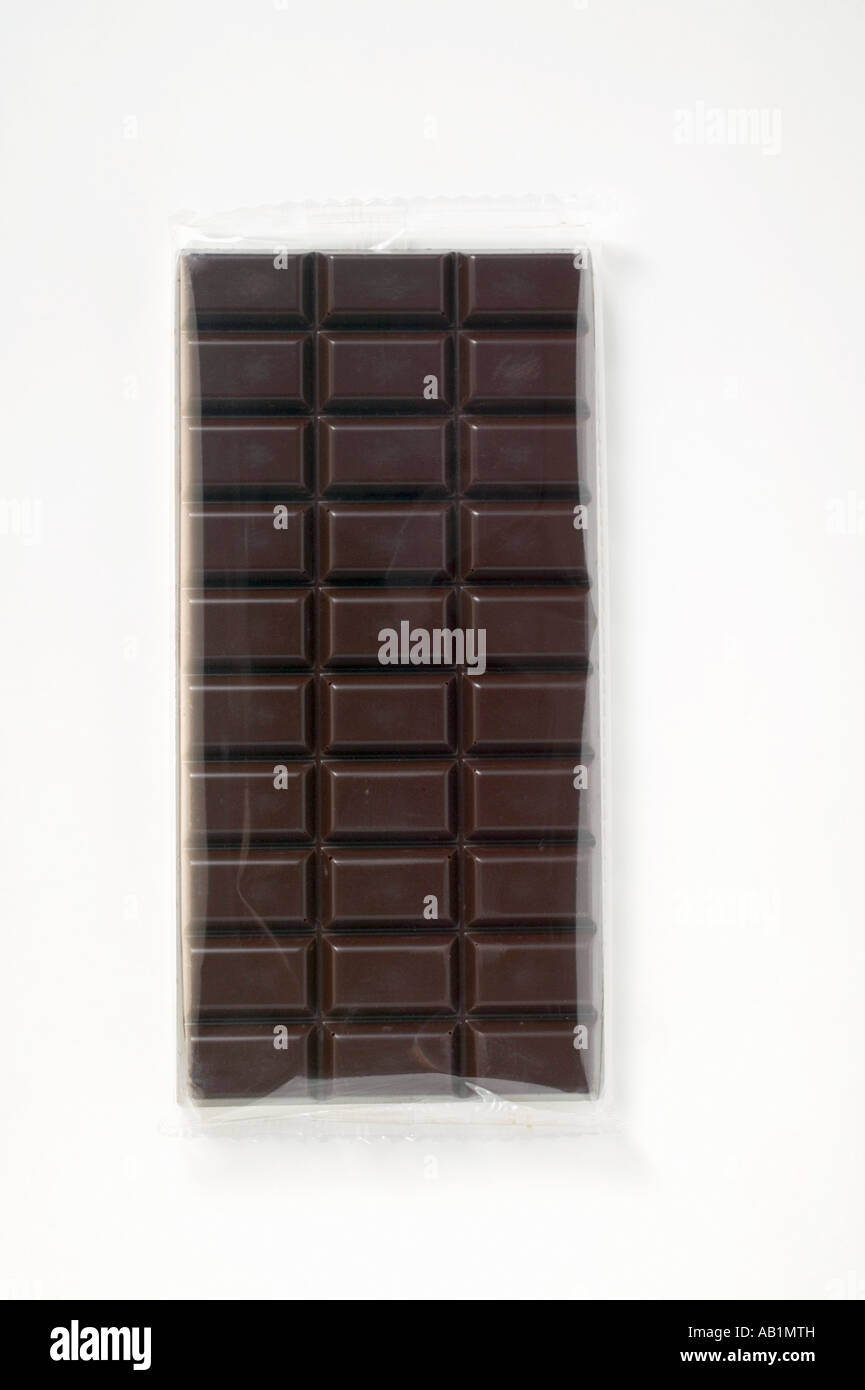 A bar of dark chocolate in cellophane FoodCollection Stock Photo