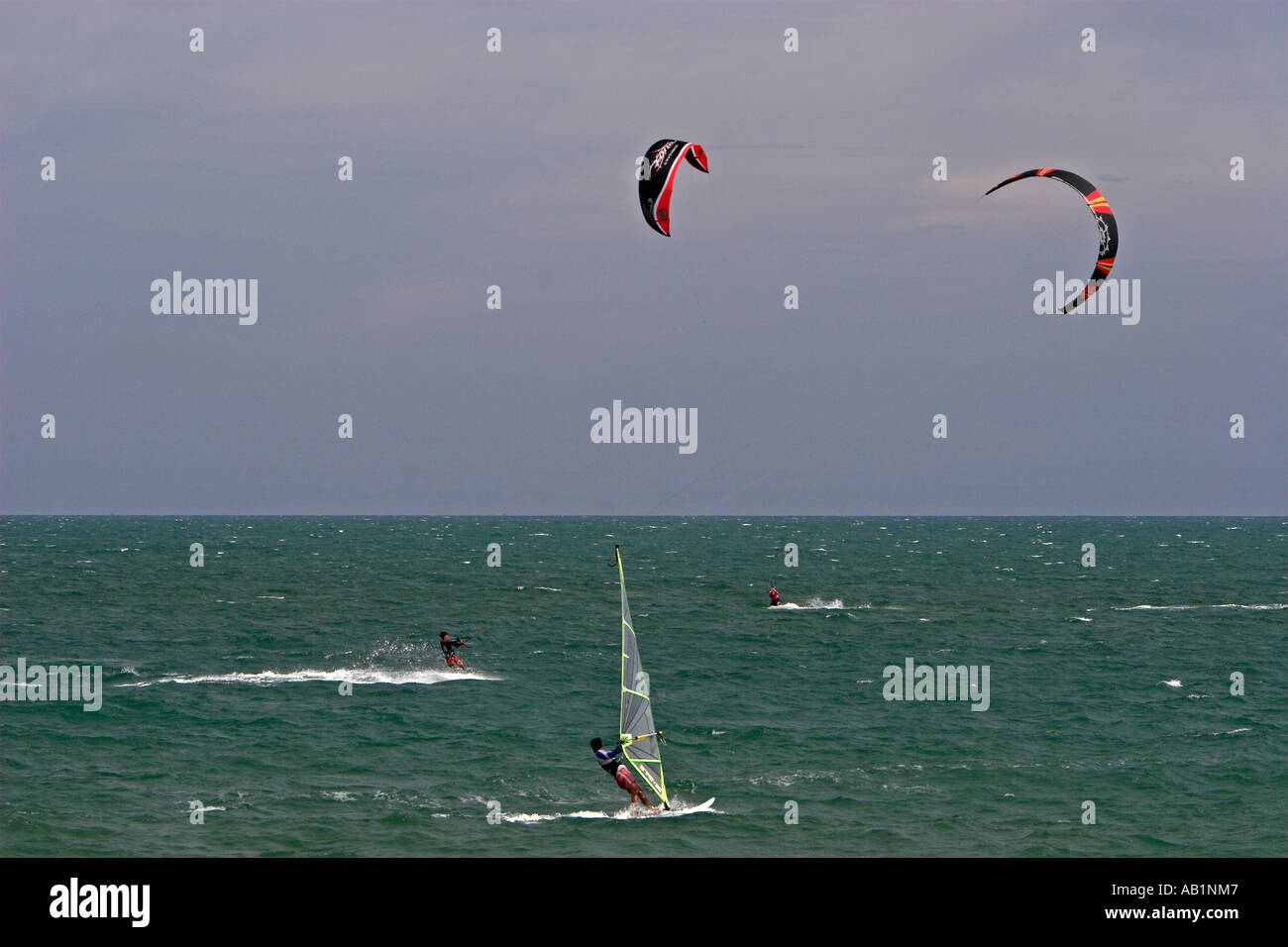 Sailboarding and parasailing is popular off the beach at Mui Ne Vietnam Stock Photo