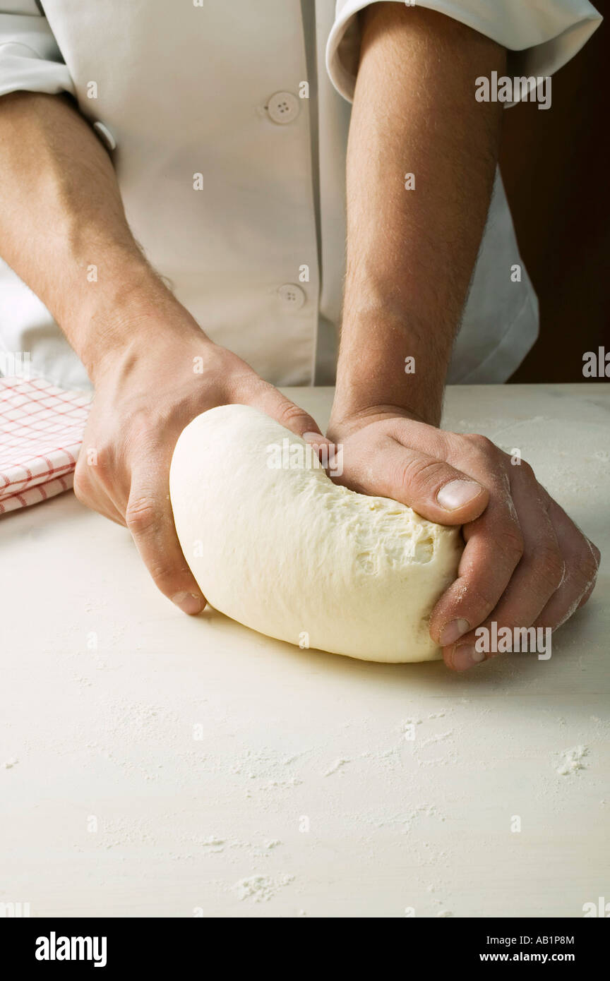Kneading pizza dough FoodCollection Stock Photo - Alamy
