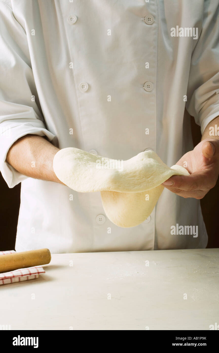 Shaping pizza dough by hand stretching FoodCollection Stock Photo Alamy