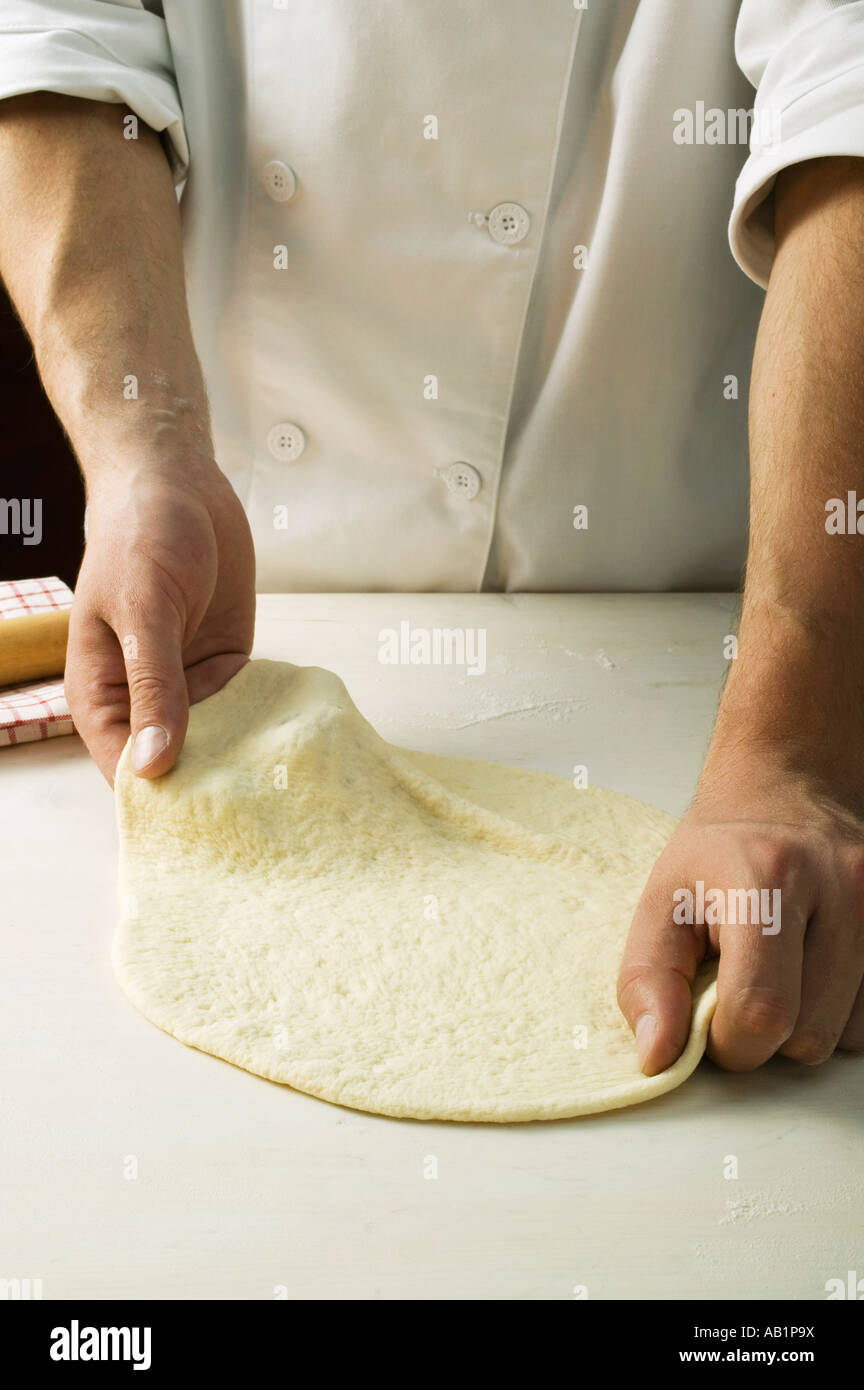 Shaping pizza dough by hand stretching FoodCollection Stock Photo Alamy