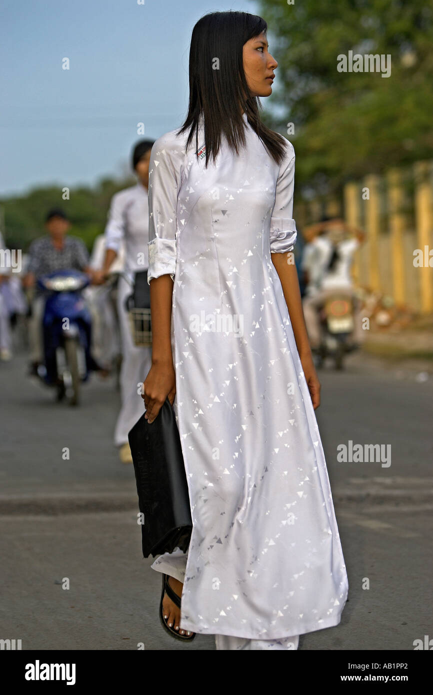 High School Girl In Traditional White Ao Dai Uniform Walks Home Phan ...