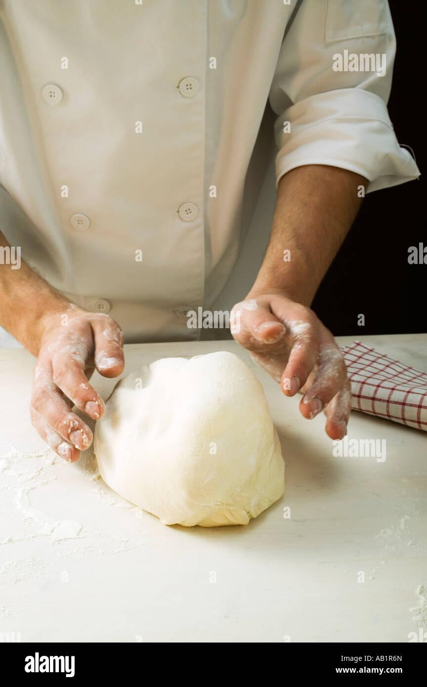 Kneading pizza dough FoodCollection Stock Photo - Alamy