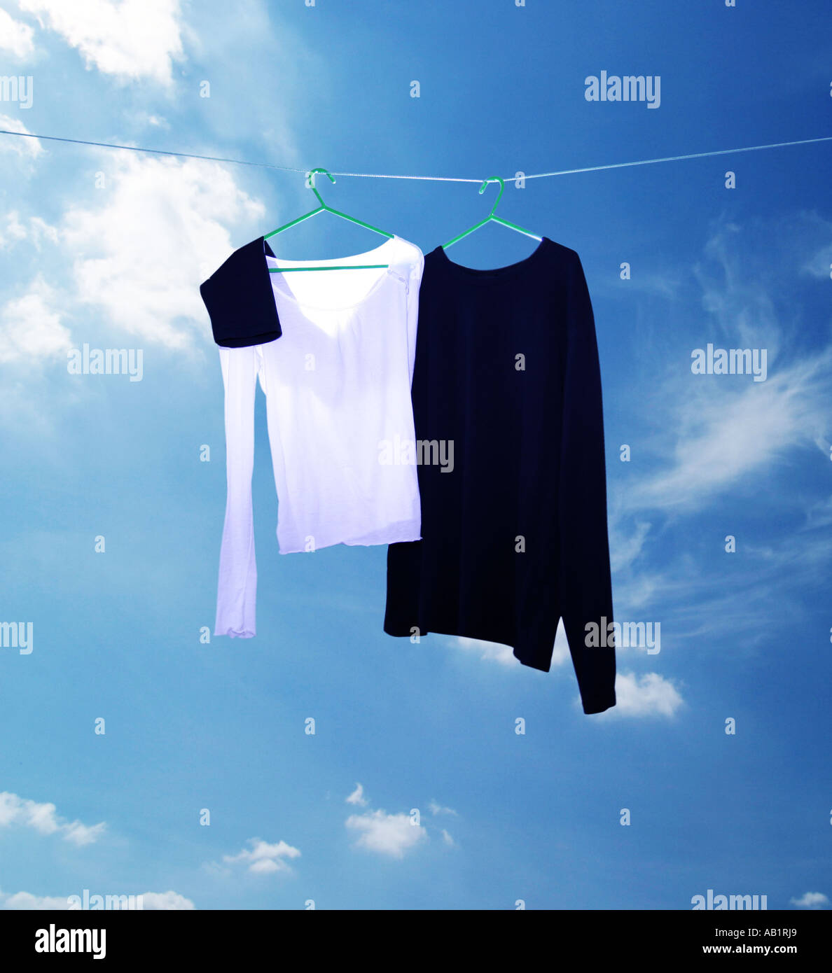 two tops on a washing line Stock Photo