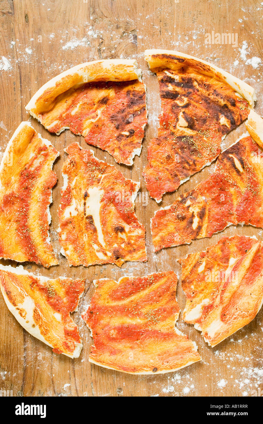 Pizza base roughly broken into pieces FoodCollection Stock Photo Alamy