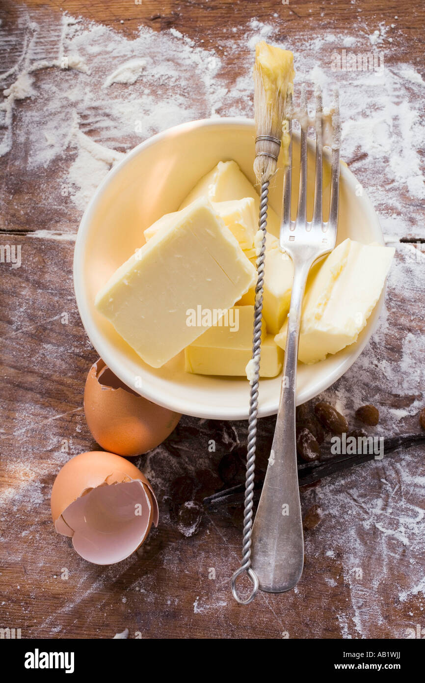 Butter in basin eggshells pastry brush and fork FoodCollection Stock ...