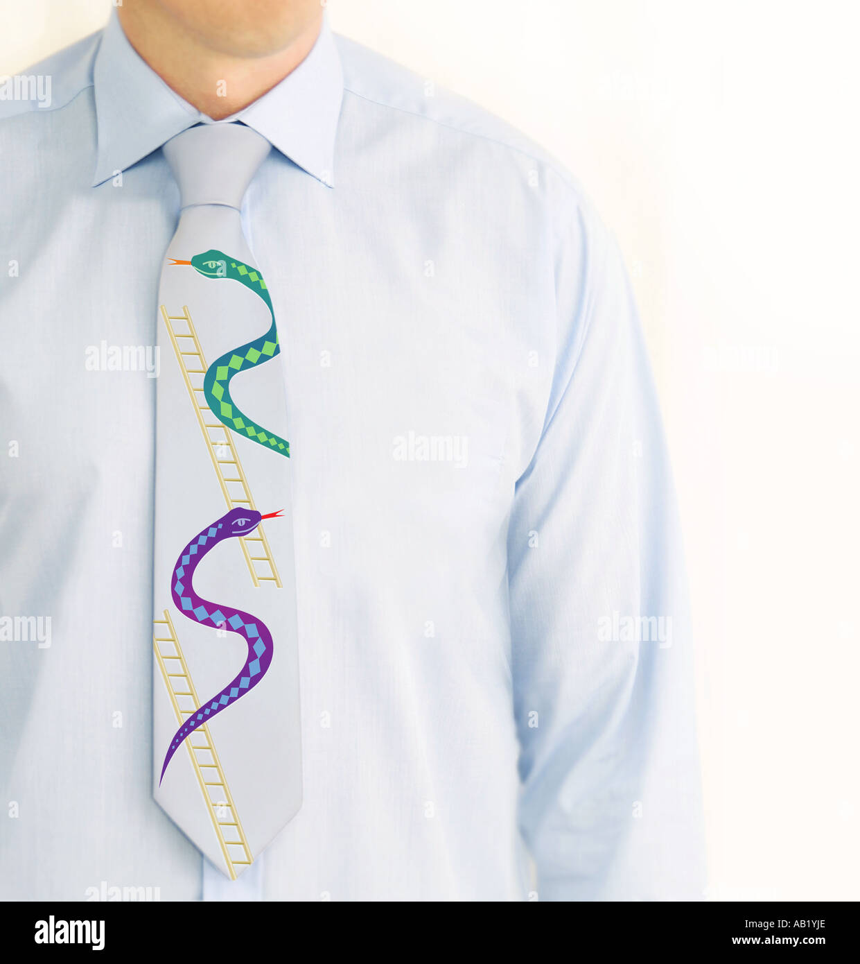 business man with snakes and ladders on his tie Stock Photo