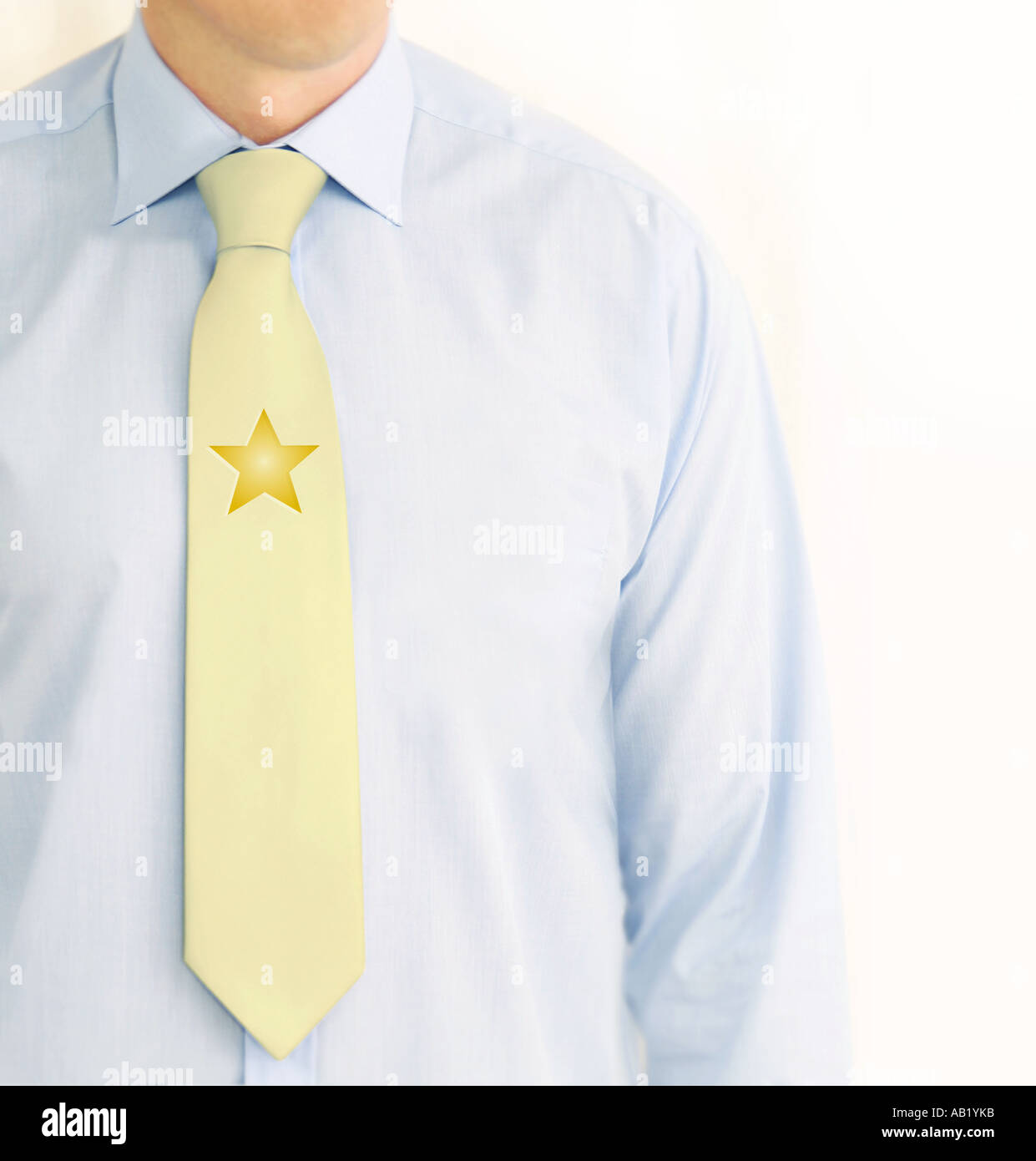 business man with a gold star on his tie Stock Photo