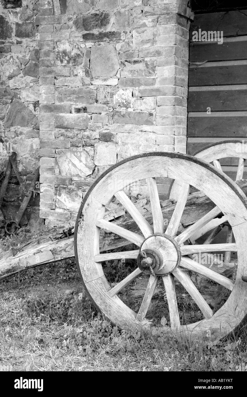 Old wooden Italian Farm used Antique Cart Wheel, San Quirico d' Orcia Tuscany Italy, Europe, EU Stock Photo