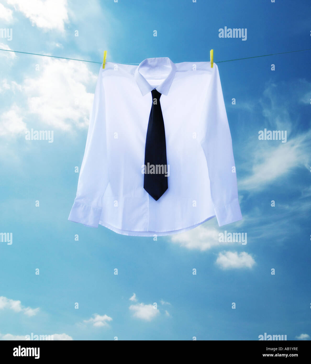 a shirt and tie handing on a washing line Stock Photo