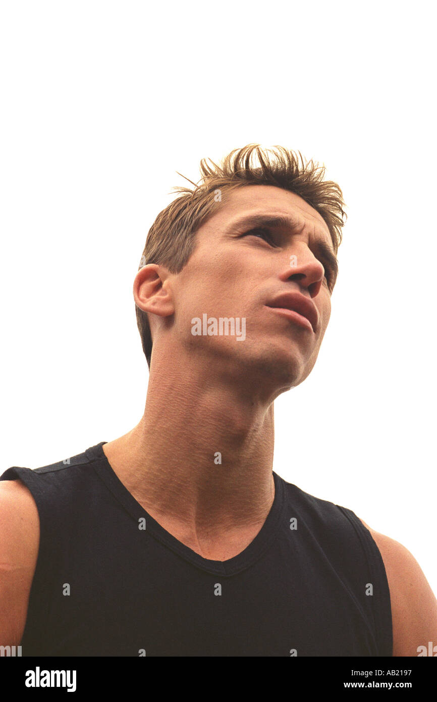 Portrait of young man looking upwards low angle Stock Photo Alamy