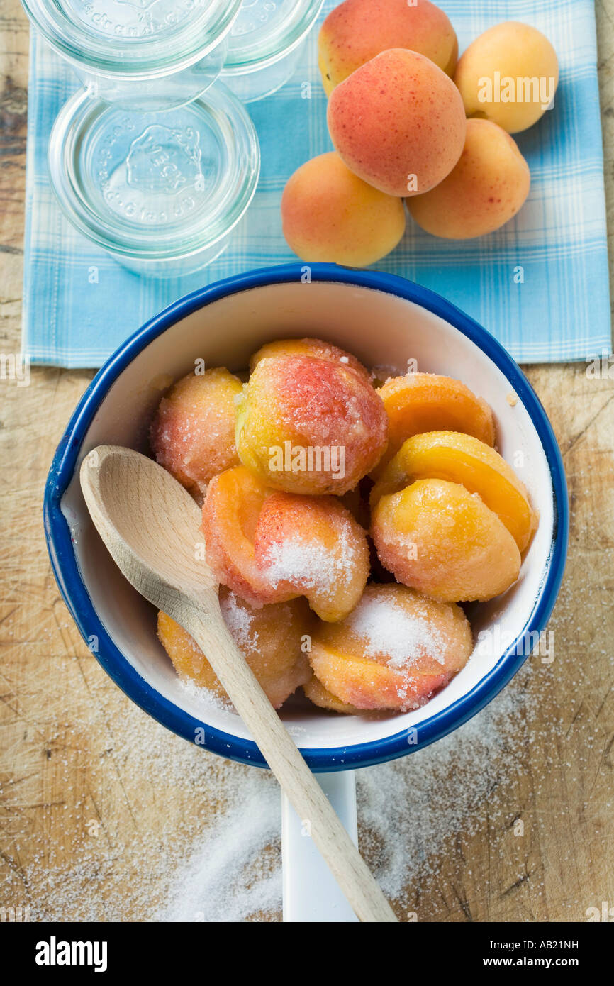 Sugared apricots in a pan preserving jars apricots FoodCollection Stock Photo