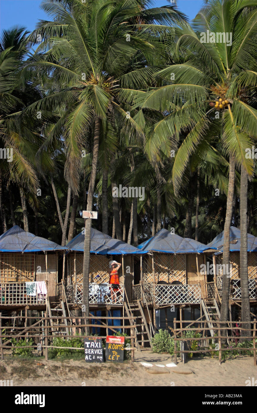 Bungalows on stilts among palm trees at beach palolem south goa india