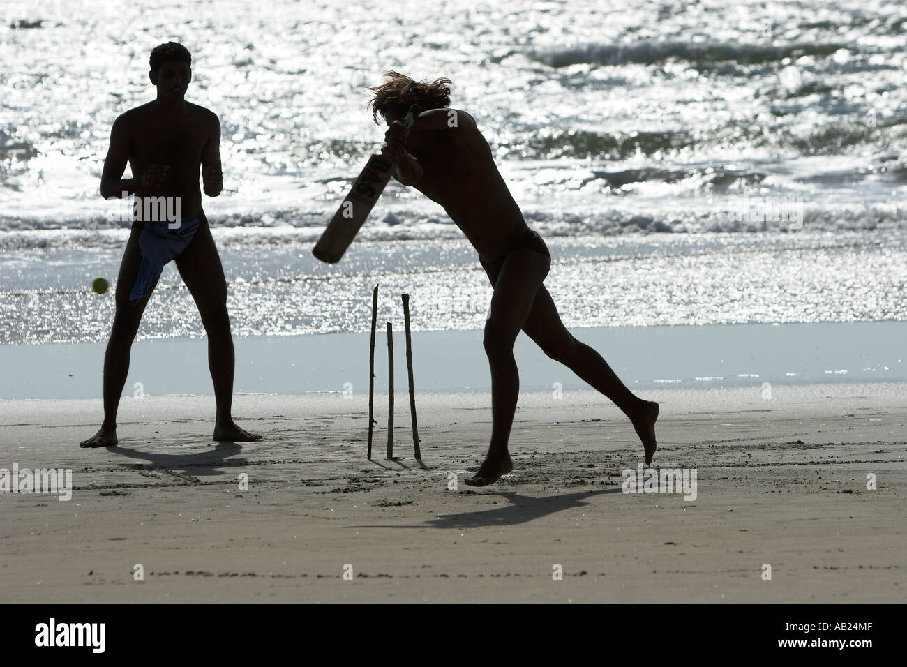 Beach cricket with bat sticks for stumps and tennis ball Fatrade Beach
