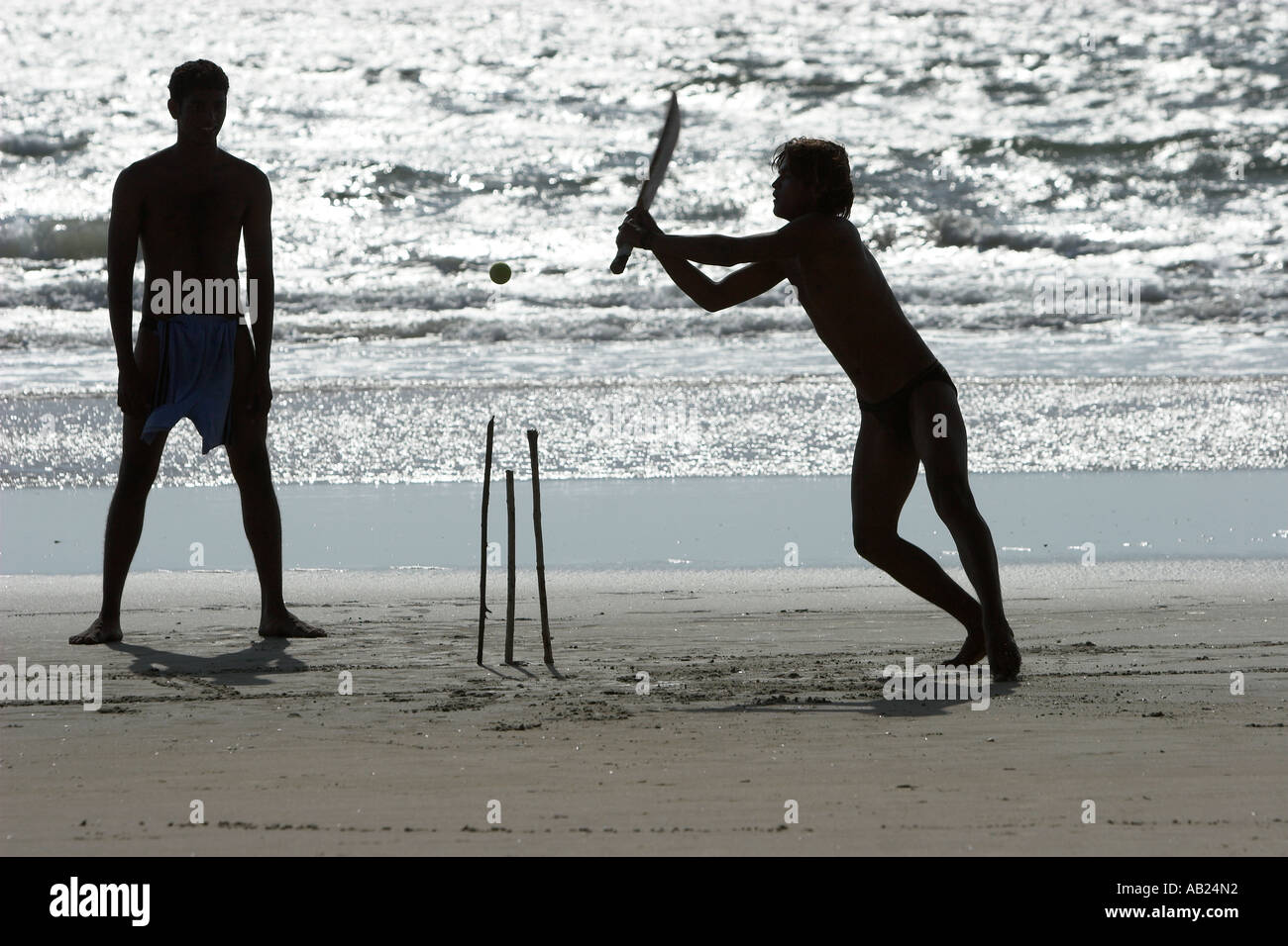 Beach cricket with bat sticks for stumps and tennis ball Fatrade Beach