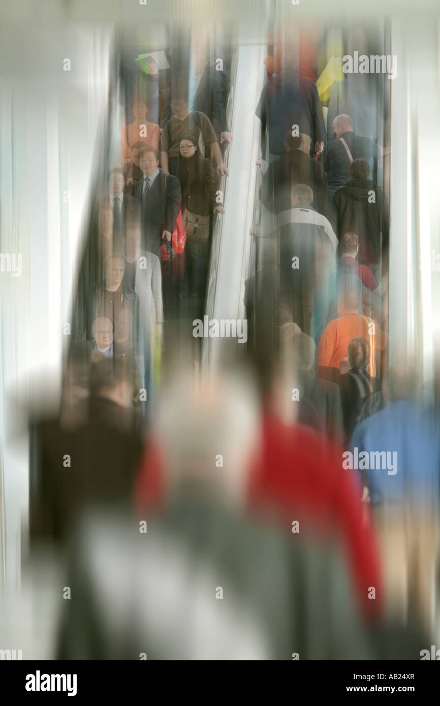 editorial use only visitors on an elevator on a fair nur redaktionell Messebesucher auf einer Rolltreppe Stock Photo