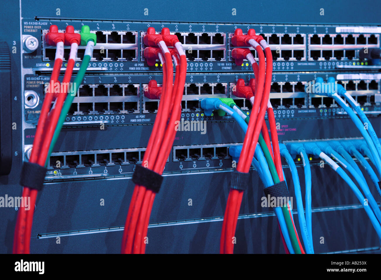 network cables and computer switches in a rack Netzwerk Kabel und Switches in einem Schaltschrank Stock Photo