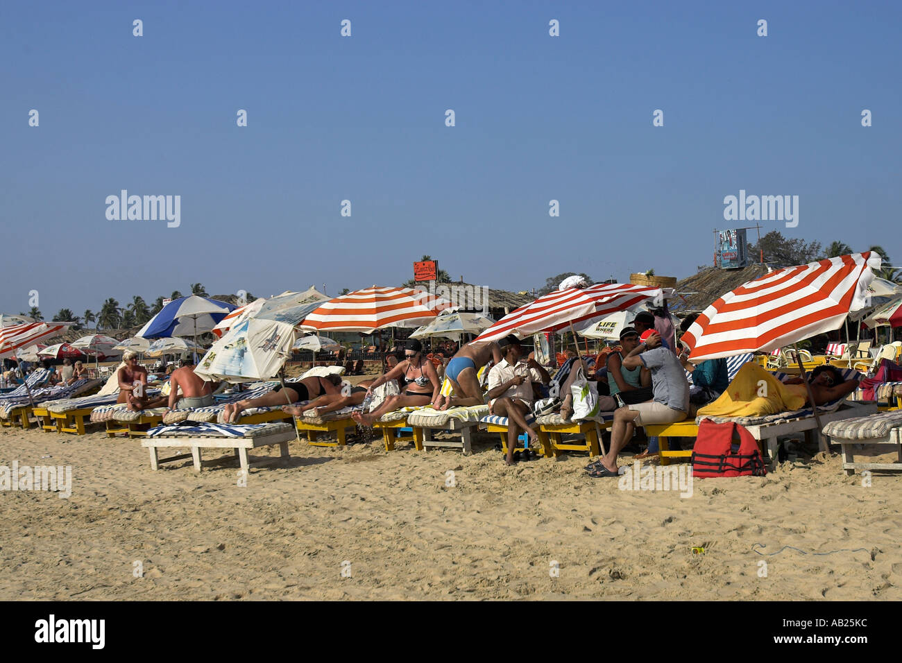 Holidaymakers crowd on to Calangute Beach Goa India Stock Photo