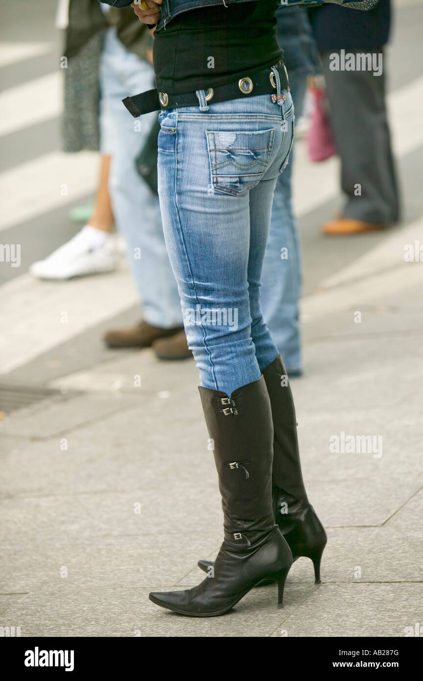 Fashionably dressed woman in black boots with high heels and tight jeans in Bilbao Bilbo the North Coast of Spain Stock Photo