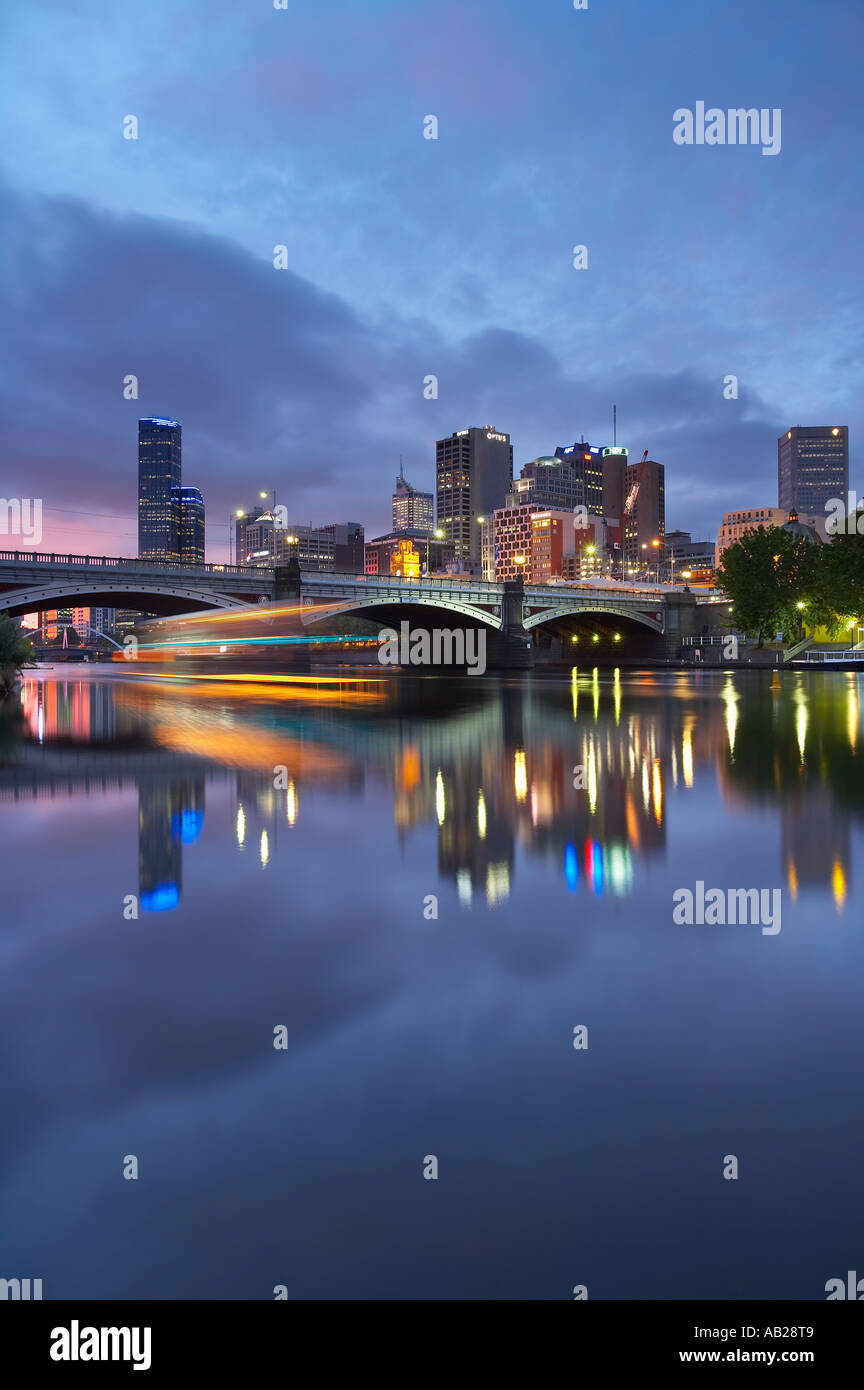 Princes Bridge and the City Centre reflected in the Yarra River at dusk Melbourne Victoria Australia Stock Photo
