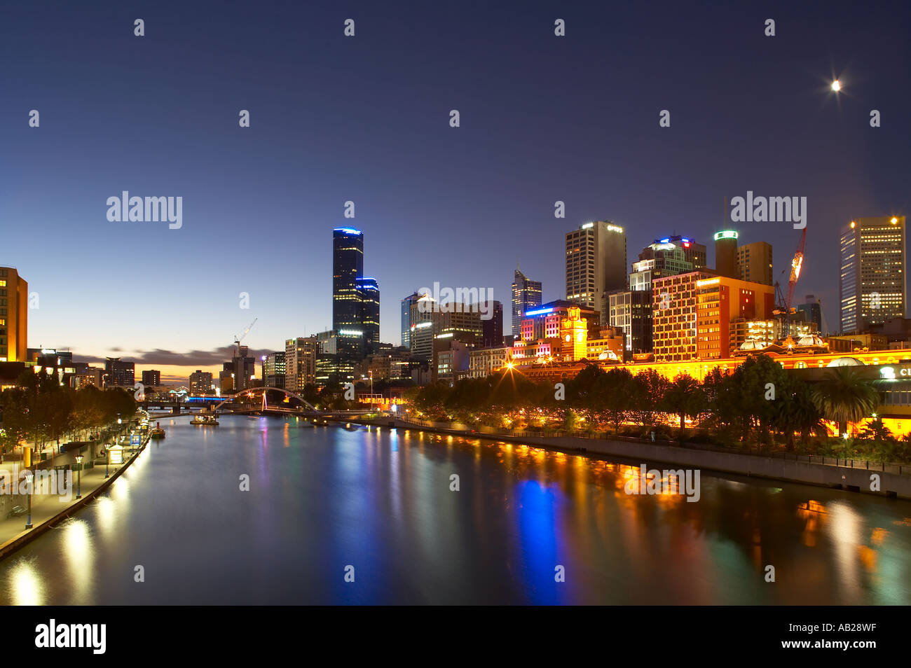 the moon over the City Centre and the River Yarra from Princes Bridge at dusk Melbourne Victoria Australia Stock Photo
