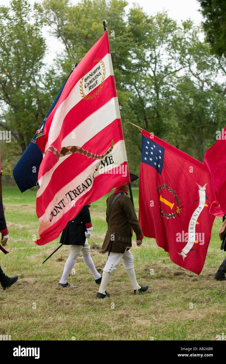 Patriot soldiers march with flags to Surrender Field as part of the