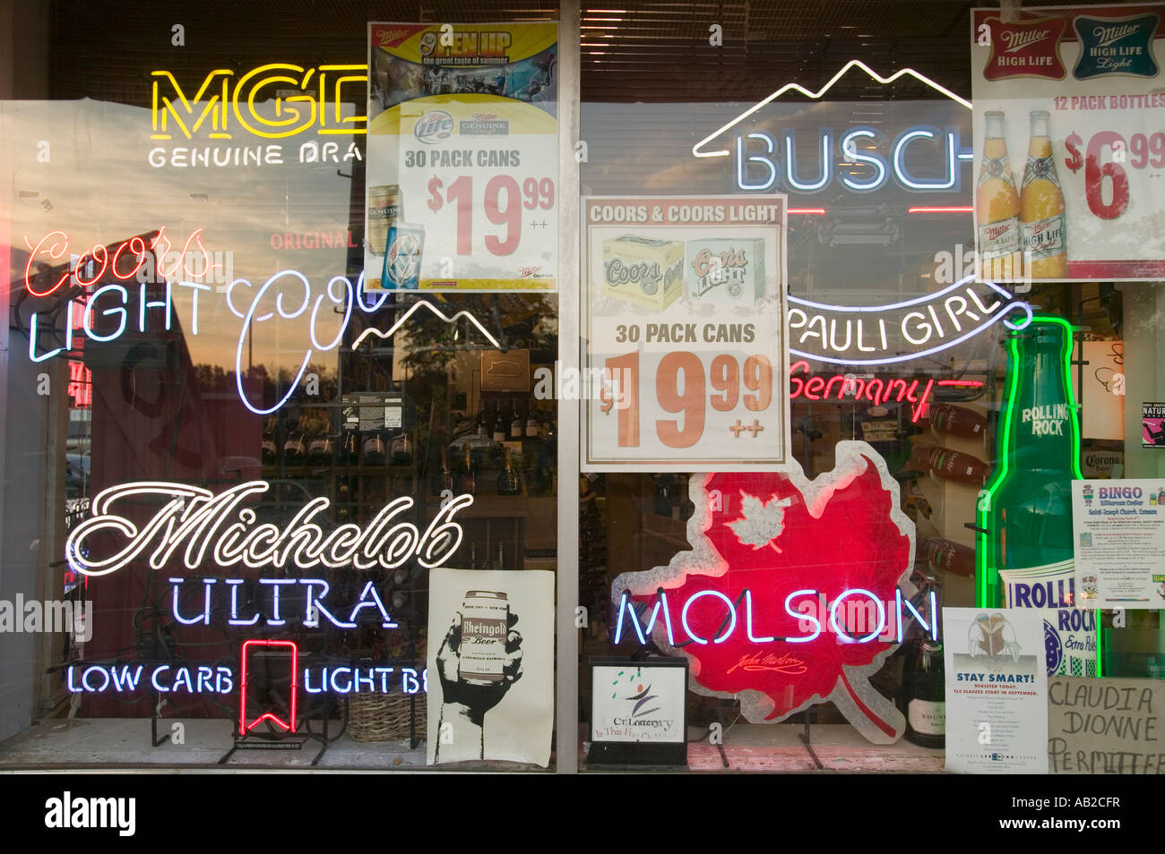 Beer signs in neon in liquor store window of Connecticut Stock Photo