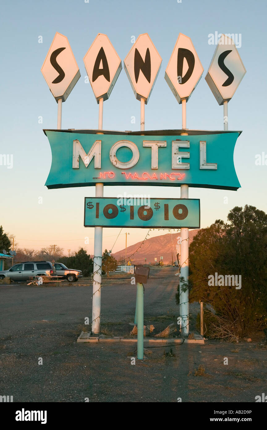 Neon lights come on at sunset at Sands Motel with RV Parking for 10 located at the intersection of Route 54 380 in Carrizozo Stock Photo