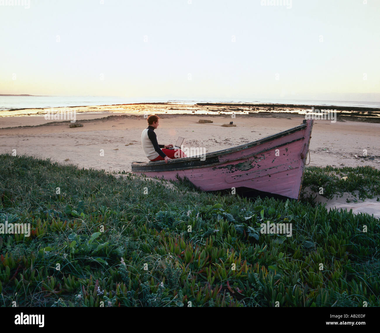 Man sitting on rock shore hi-res stock photography and images - Alamy