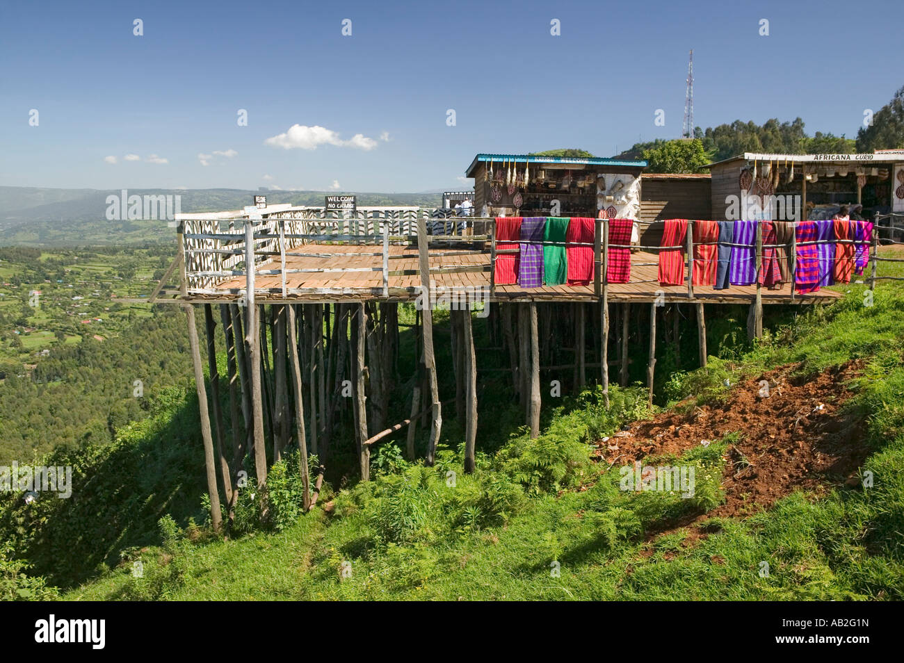 Masai blankets hang on deck overlooking Great Rift Valley in springtime Kenya Africa Stock Photo