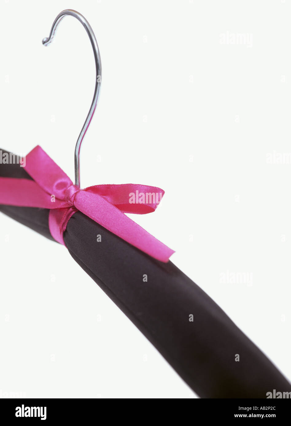 A coat hanger with a pink ribbon detail Stock Photo