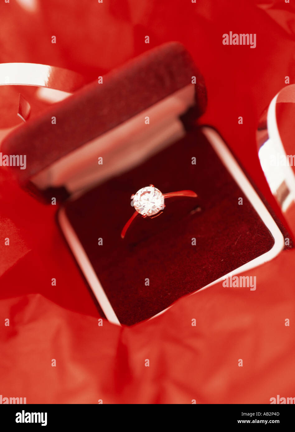 A diamond ring in a red velvet box Stock Photo