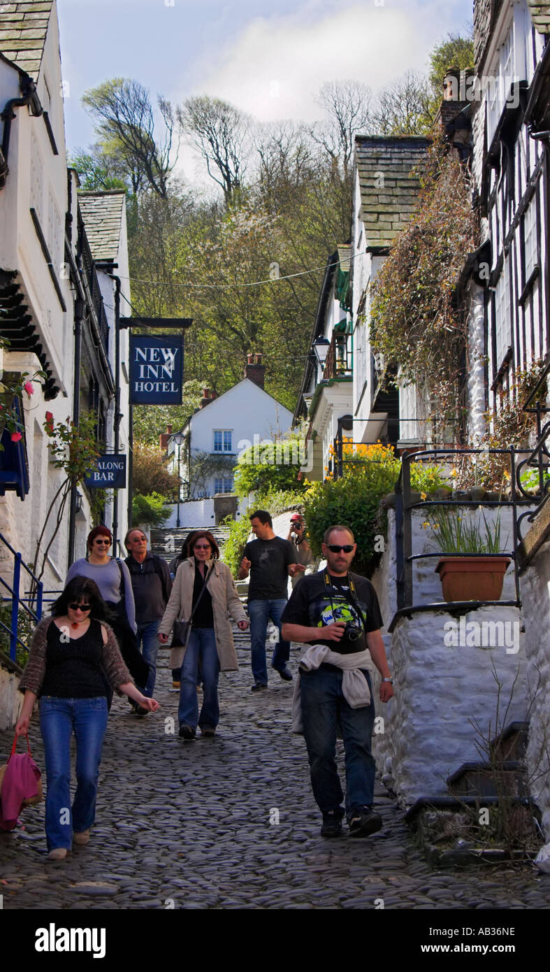 Tourists decending the steep cobbled main street in Clovelly North Devon England Stock Photo
