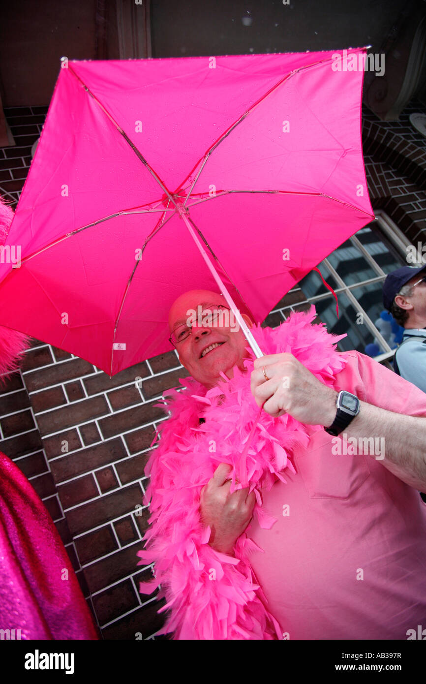 Man with pink umbrella at the 2007 London Gay Pride March Stock Photo