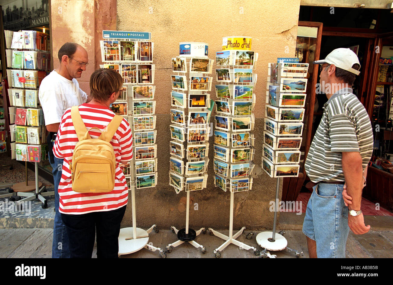 Tourists at a postcard stand in Alcudia in Northern Majorca Stock Photo