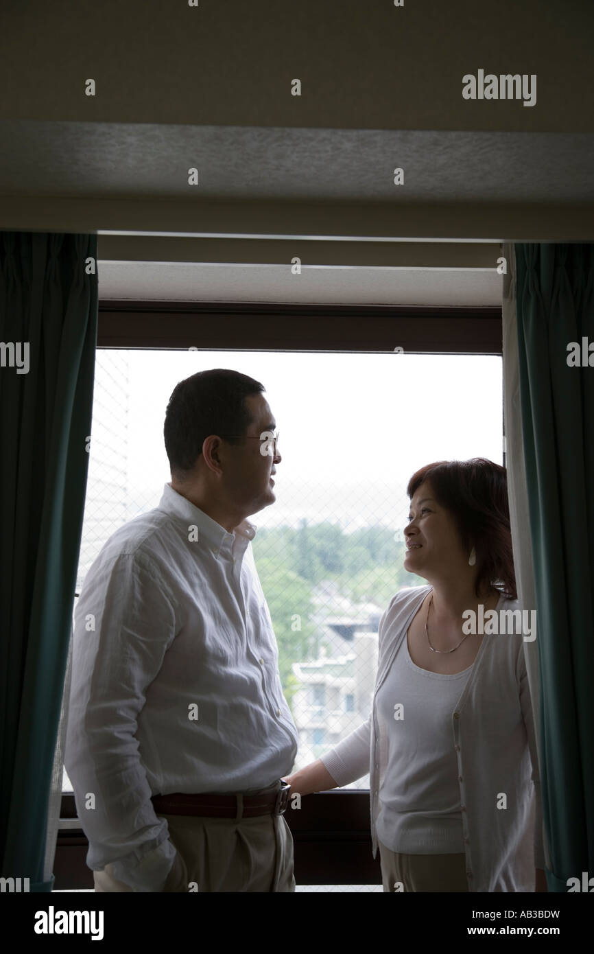 Mature couple standing on balcony Stock Photo