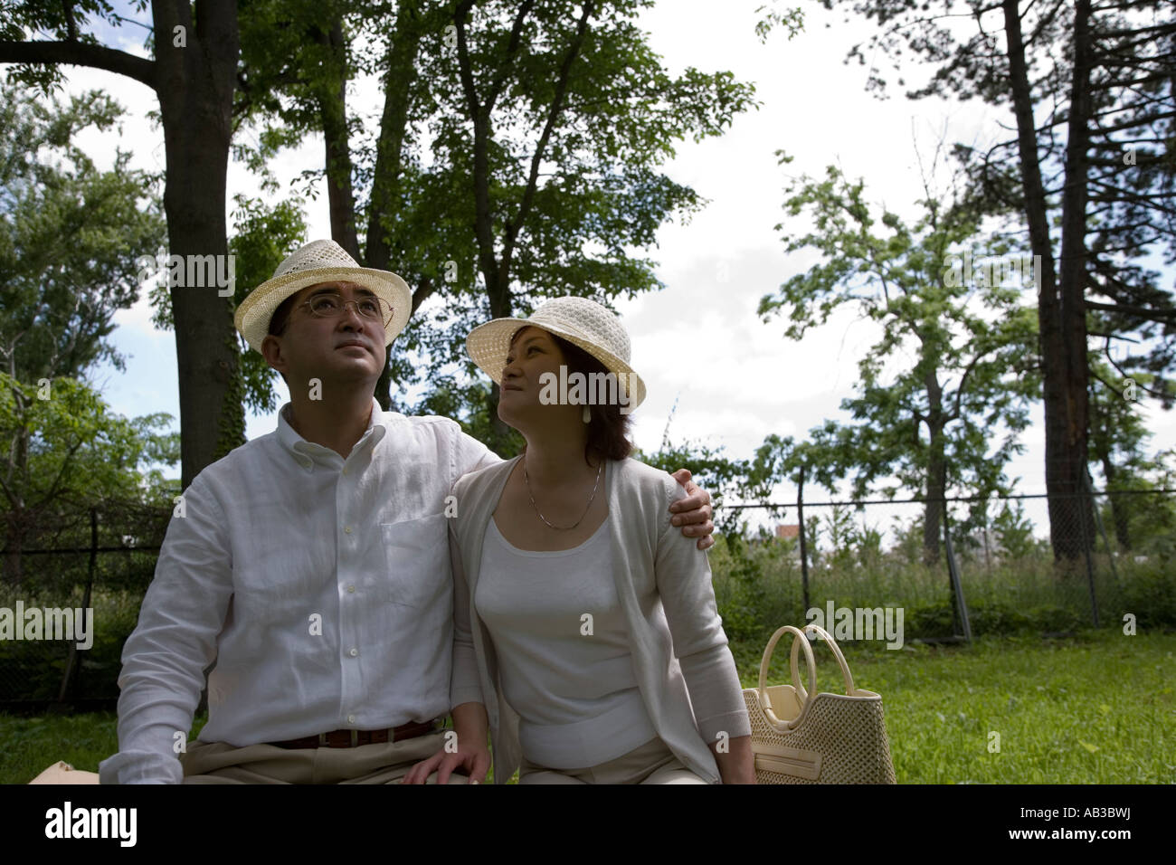 Mature couple sitting on bench Stock Photo