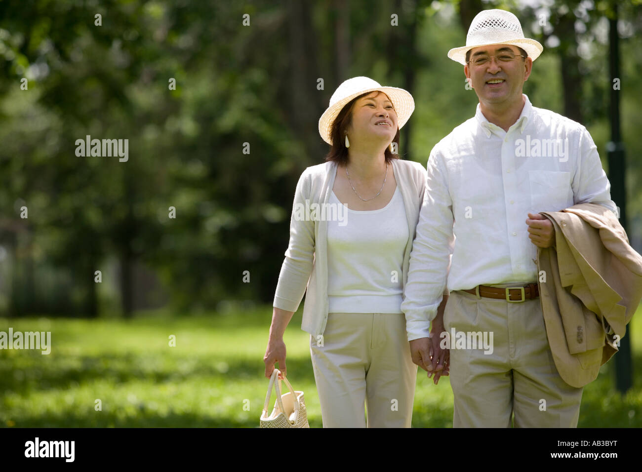 Mature couple walking in park Stock Photo - Alamy