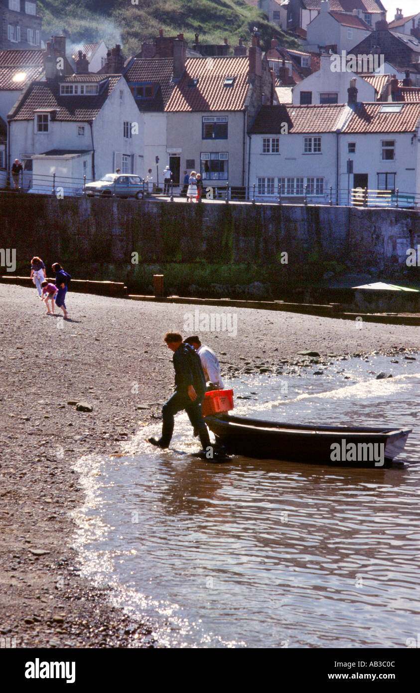 Bringing Home the Catch Stock Photo - Alamy
