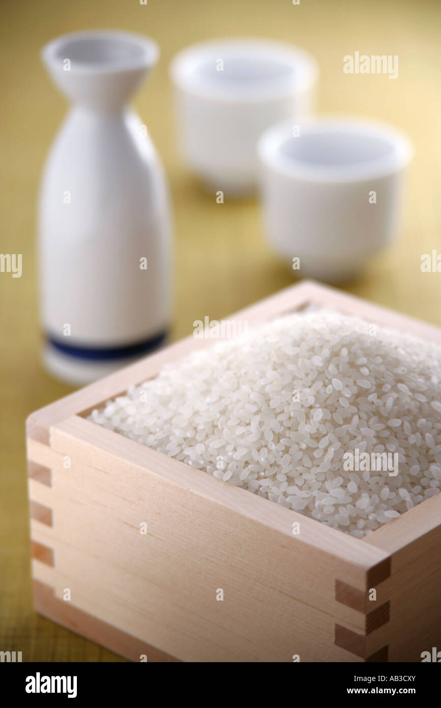 Uncooked rice and sake cups Stock Photo - Alamy