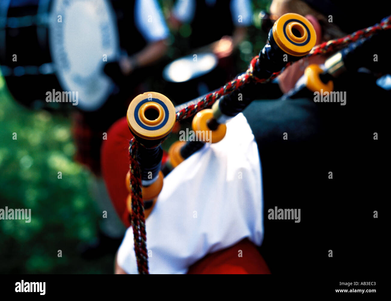 highland piper playing a tune on his scottish bagpipes Stock Photo