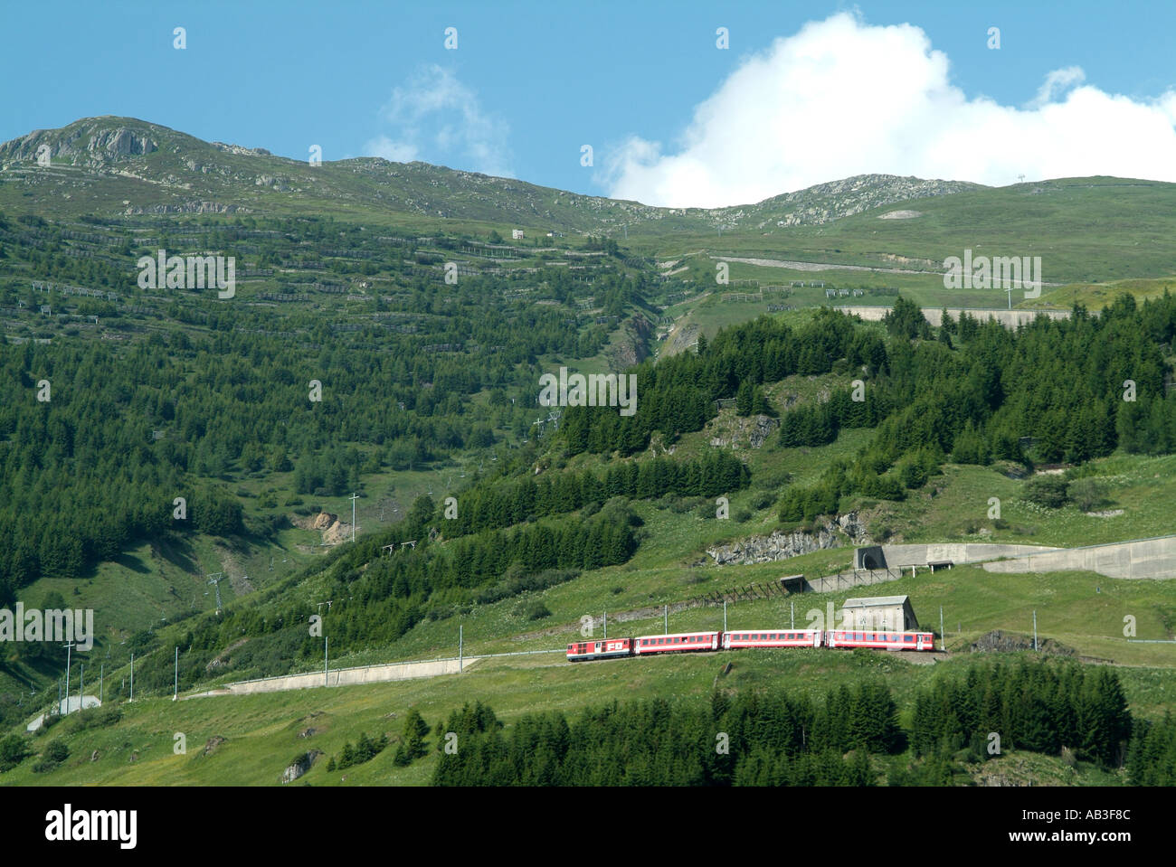 Swiss train decending towards Andermatt Switzerland Stock Photo